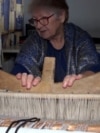  Museum "Bosnian room", Doboj, Bosnia and Herzegovina, a woman weaves a carpet