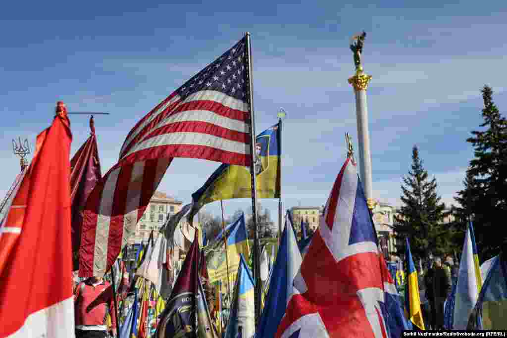 Flags at a makeshift memorial to fallen fighters seen beneath Kyiv's Independence Monument on March 14.