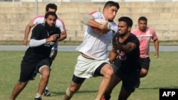 Mustafa Sadat (center) plays in a rugby tournament in Lahore, Pakistan in October 2011.