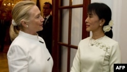 U.S. Secretary of State Hillary Clinton (left) meets with Aung San Suu Kyi in Rangoon on December 1.