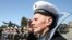 Ukrainian World War II veterans stand at attention during Ukraine's national anthem. Some consider the song's warlike theme to be outdated.