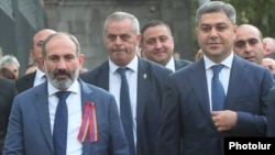 Armenia -- Prime Miinister Nikol Pashinian and National Security Service Director Artur Vanetsian (R) walk in downtown Yerevan, September 21, 2018.