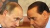 Italian Prime Minister Silvio Berlusconi (right) and his Russian counterpart, Vladimir Putin, confer during Putin's visit to Italy on April 26.