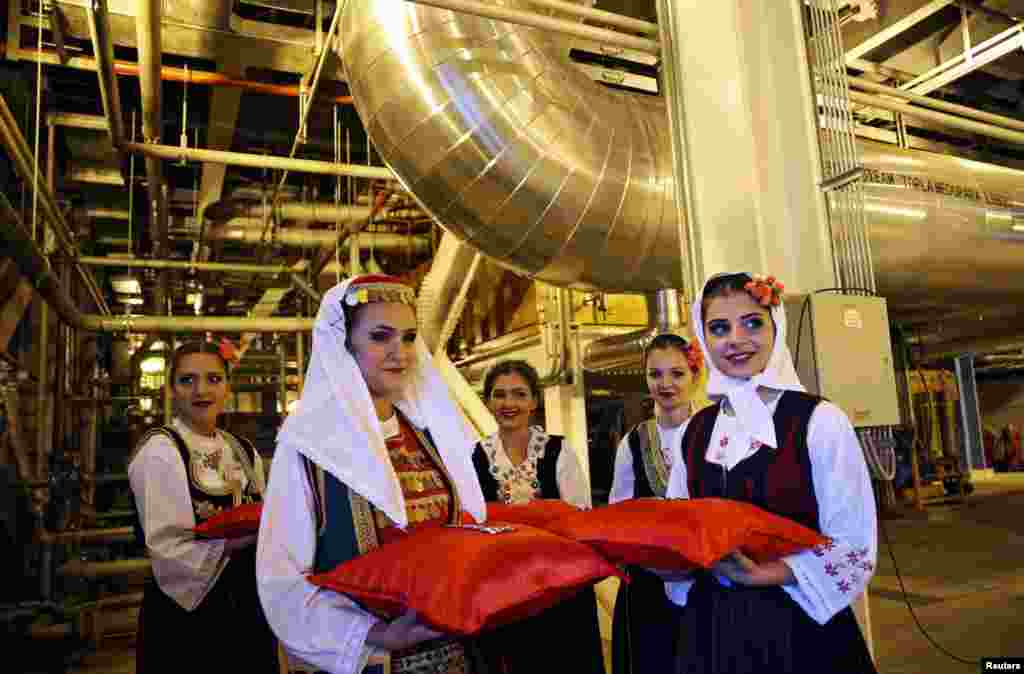 Women in traditional clothing attend a ceremony marking the official commissioning of a 300-megawatt, coal-fired power plant in Stanari, Bosnia-Herzegovina. (Reuters/Dado Ruvic)