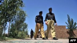 Pakistanyň polisiýa işgärleri.