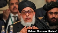 Head of Political Office of the Taliban Sher Mohammad Abbas Stanakzai prays at a conference in Moscow on February 5.