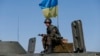 Ukrainian Adversaries Sign Cease-Fire 