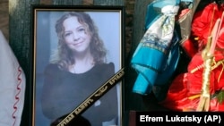 Iryna Nozdrovska is seen in a photograph that was placed near her coffin in her hometown of Demydiv on January 9.