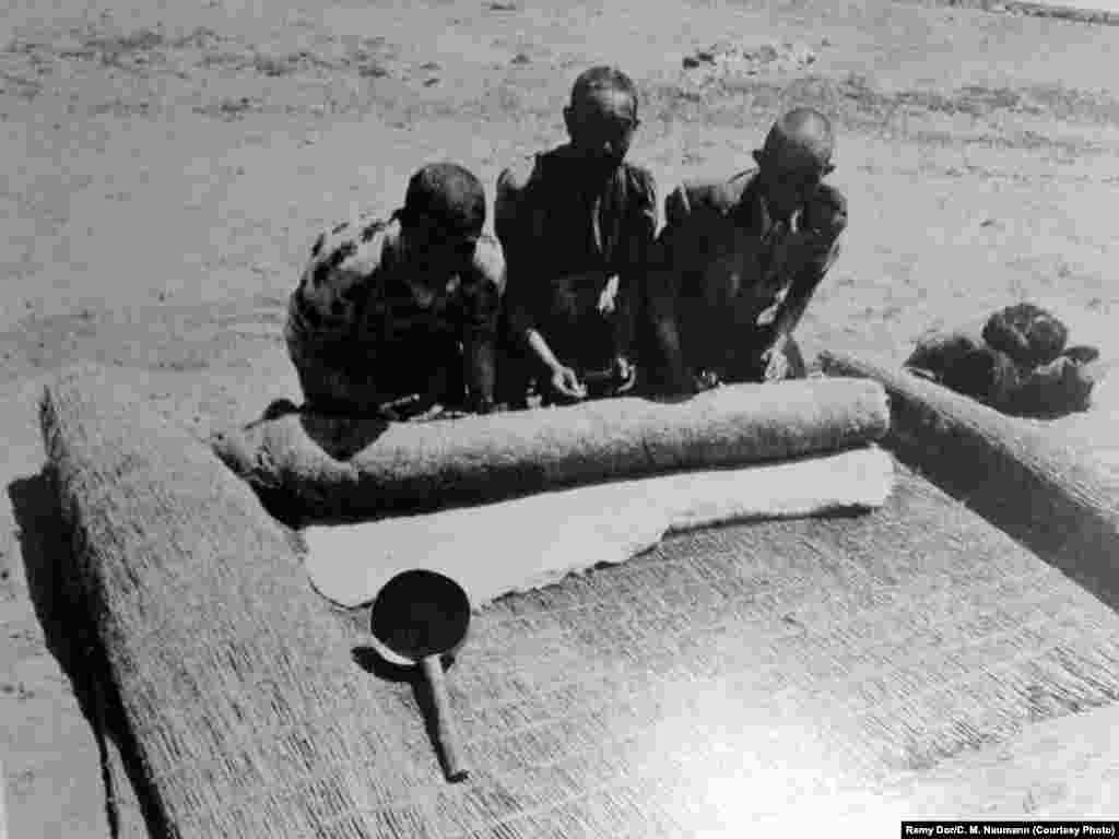 An archival photo of men pressing felt, one of the items traded by the Pamir Kyrgyz.