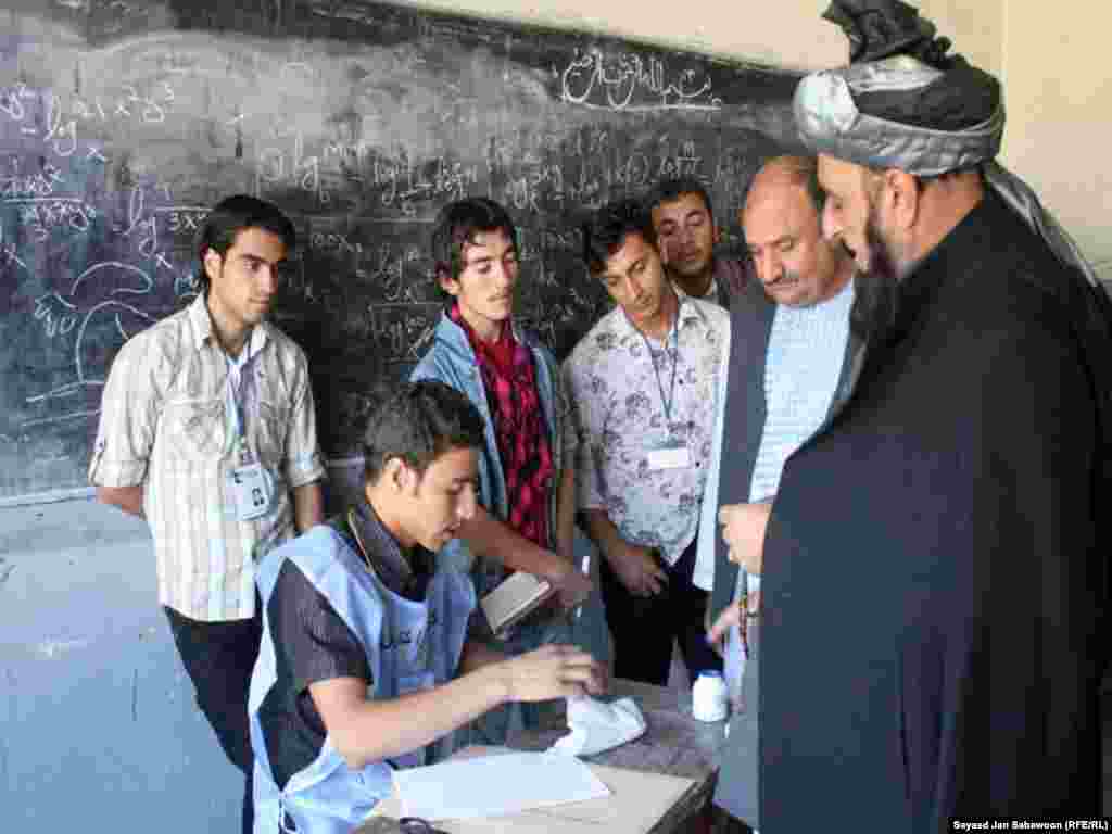 Despite the presence of more than 400,000 Afghan and international forces, election authorities said more than 1,000 polling stations in the south and east of the country could not be opened for security reasons. In Kabul, an Afghan man casts his vote at a polling station. 