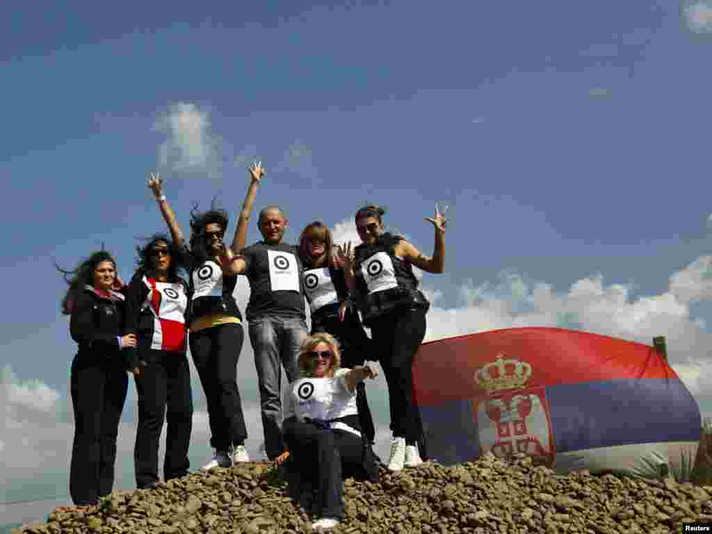 Ethnic Serbs pose for a picture at the barricades at the closed Serbia-Kosovo border crossing of Jarinje. (REUTERS/Marko Djurica)