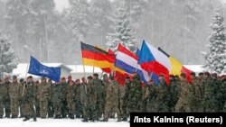 Militari NATO care formează grupul de luptă din Lituania, la baza militară Rukla, 4 februarie 2019.