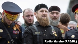 Chechen leader Ramzan Kadyrov (center) is behind a campaign of intimidation that includes instances of torture, humiliation, and even murder, according to Human Rights Watch.