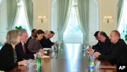 Azerbaijan -- U.S. National security adviser John Bolton, second left, and Azerbaijan's President Ilham Aliyev, right, during talks in Baku, Azerbaijan, Wednesday, Oct. 24, 2018.