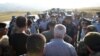 Armenian war veterans and army volunteers with the intention of unblocking the Lachin Corridor are confronted by law enforcement officers on a road just before the checkpoint.