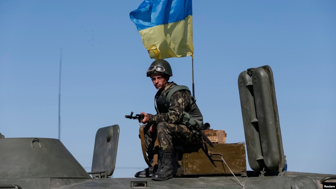 A Ukrainian serviceman stands at a checkpoint near Debaltseve, a city in the Donetsk Oblast.