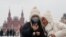Young women wearing medical masks in Moscow on January 28.