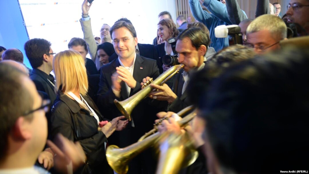 Ruling Serbian Progressive Party (SNS) members celebrated the party's victory on election night in Belgrade on March 16.