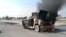 Smoke rises from an army vehicle following an attack by armed militants in Fallujah, where the Iraqi government has been conducting military operations against militants in control of the western city. (file photo)