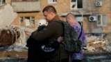 Survivors Of Russia's Attack On Kyiv Sort Through Aftermath2 GRAB