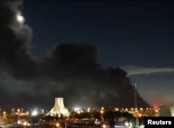 Smoke rises over Azadi Square in Tehran following a strike on the Iranian capital early on April 6.