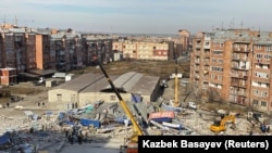 Members of the emergency services work at the site of a collapsed building after an explosion in Vladikavkaz on February 12.