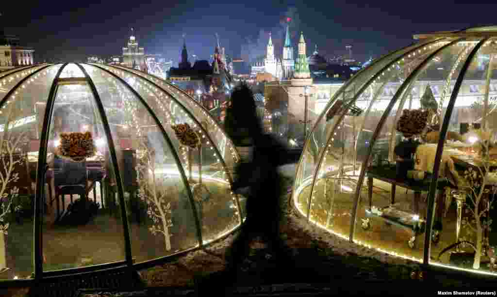 Clear domes allow guests to dine privately on the rooftop of the Ritz-Carlton hotel in Moscow with a view of the Kremlin and Red Square. &nbsp;