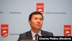 FATF (the Financial Action Task Force) President Xiangmin Liu attends a news conference after a plenary session at the OECD Headquarters in Paris on October 18.