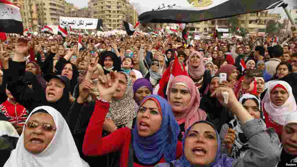 Antigovernment protesters chant slogans against President Muhammad Morsi in Tahrir Square in Cairo on November 27. Opponents of Morsi clashed with Egyptian police as thousands of protesters stepped up pressure on the president to scrap a decree they say threatens the nation with a new era of autocracy. (Reuters/Asmaa Waguih)