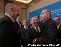 Turkish President Recep Tayyip Erdogan (right), former Kazakh President Nursultan Nazarbaev (second from right), Uzbek President Shavkat Mirziyoev (second from left) and Azerbaijani President Ilham Aliyev (left) speak at a meeting of the Cooperation Council of Turkic Speaking States in Baku in 2019.