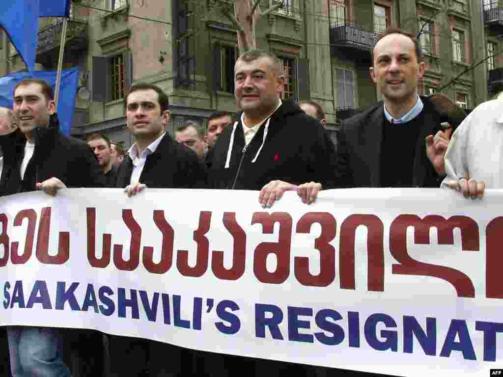 GEORGIA, Tbilisi : Georgian opposition leaders Levan Gachechiladze (3R) and Irakly Alasania (4R) march in a rally in Tbilisi on April 9, 2009. Tens of thousands of anti-government demonstrators massed in the Georgian capital, launching a protest movement aimed at forcing the resignation of President