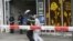 Police cordon off the area around a supermarket in the northern German city of Hamburg, where a deadly knife attack occurred on July 28. 