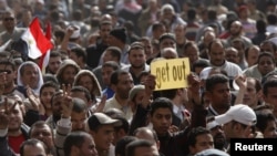 Opposition supporters rally after Friday prayers in Cairo's Tahrir square.