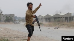 A fighter loyal to Libya's UN-backed government during a clash with forces loyal to Khalifa Haftar on the outskirts of Tripoli.