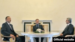 Presidents Dmitry Medvedev of Russia (center), Serzh Sarkisian of Armenia (right), and Ilham Aliyev of Azerbaijan meet in St. Petersburg on June 17.