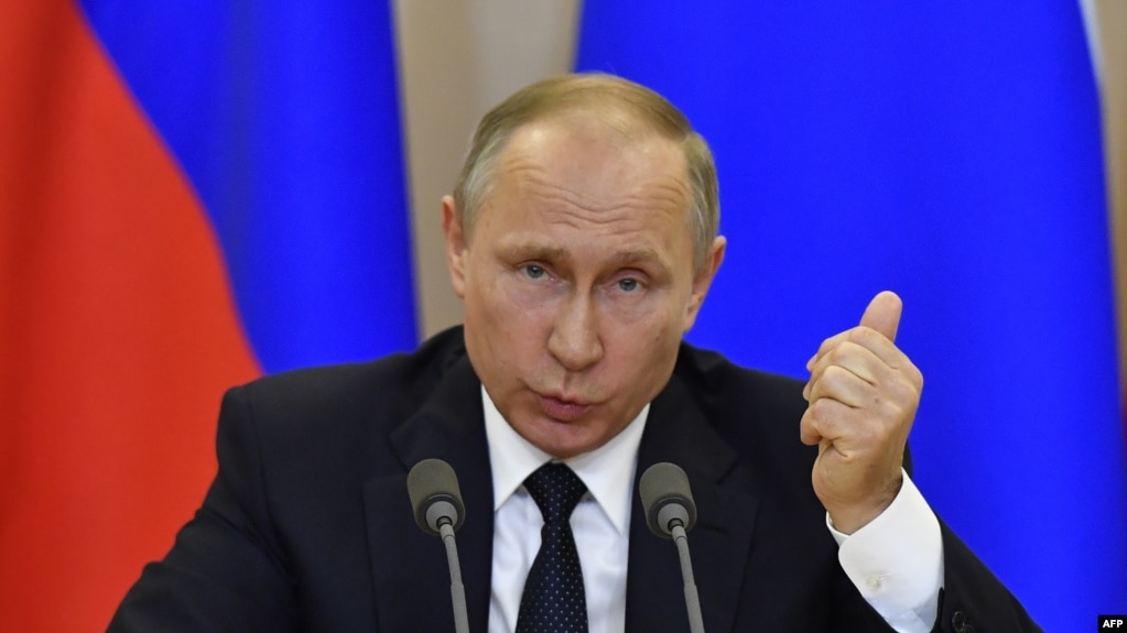 Russian President Vladimir Putin speaks during a joint press conference with Italian Prime Minister Paolo Gentiloni following their meeting in Sochi on May 17.