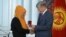 Kyrgyz President Almazbek Atambaev handed out awards to a dozen citizens of different ethnic backgrounds who sheltered and saved families on both sides of the ethnic divide in 2010.