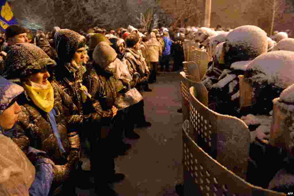 Pro-EU Ukrainian protesters face off with security forces.