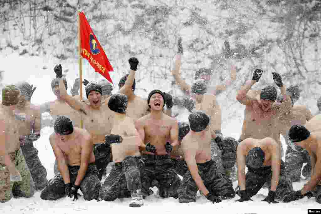 South Korean and U.S. Marines hurl snow during a winter military drill in Pyeongchang, South Korea. (Reuters/Kim Hong-ji)