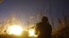 A Ukrainian serviceman shoots a machine gun during fighting with Russia-backed separatists near Avdiyivka in eastern Ukraine on November 3. 