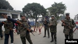 Indian security personnel stand guard inside the Indian Air Force (IAF) base Pathankot on January 4.