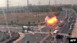 An image grab from footage taken from a CCTV camera belonging to the Israeli government company showing a rocket exploding over a highway. November 12, 2019