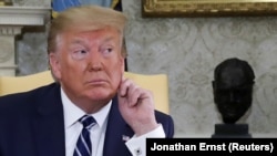 U.S. -- U.S. President Donald Trump listens to questions during a meeting with Canadian Prime Minister in the Oval Office of the White House in Washington, June 20, 2019