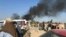 Smoke rises from a bomb blast during a funeral ceremony in Jalalabad on December 31.