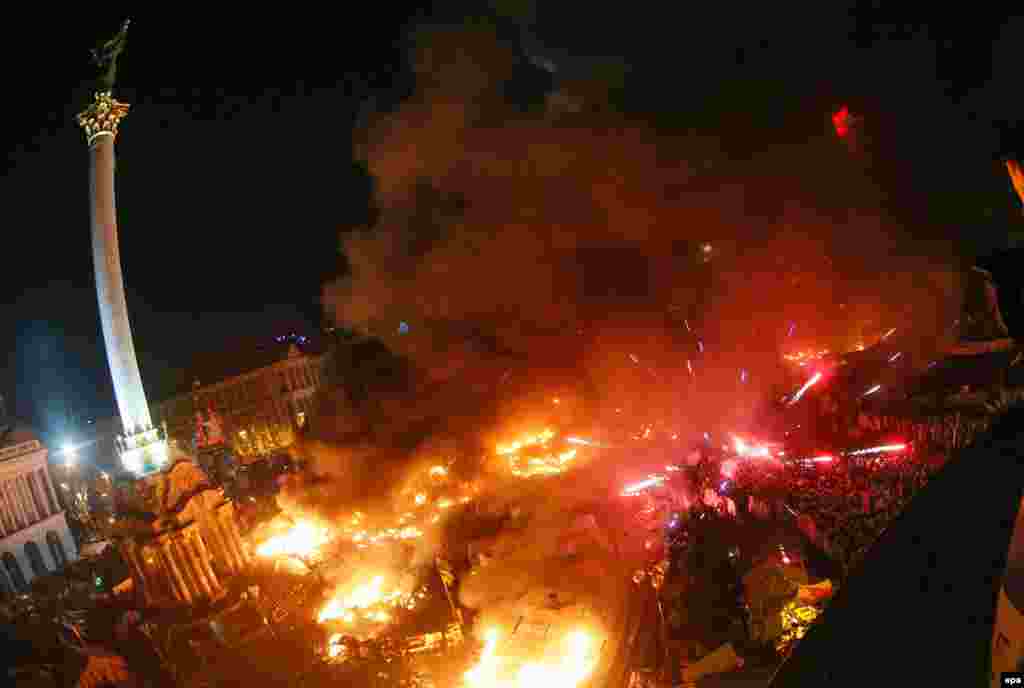 Flames and fireworks light up Independence Square.