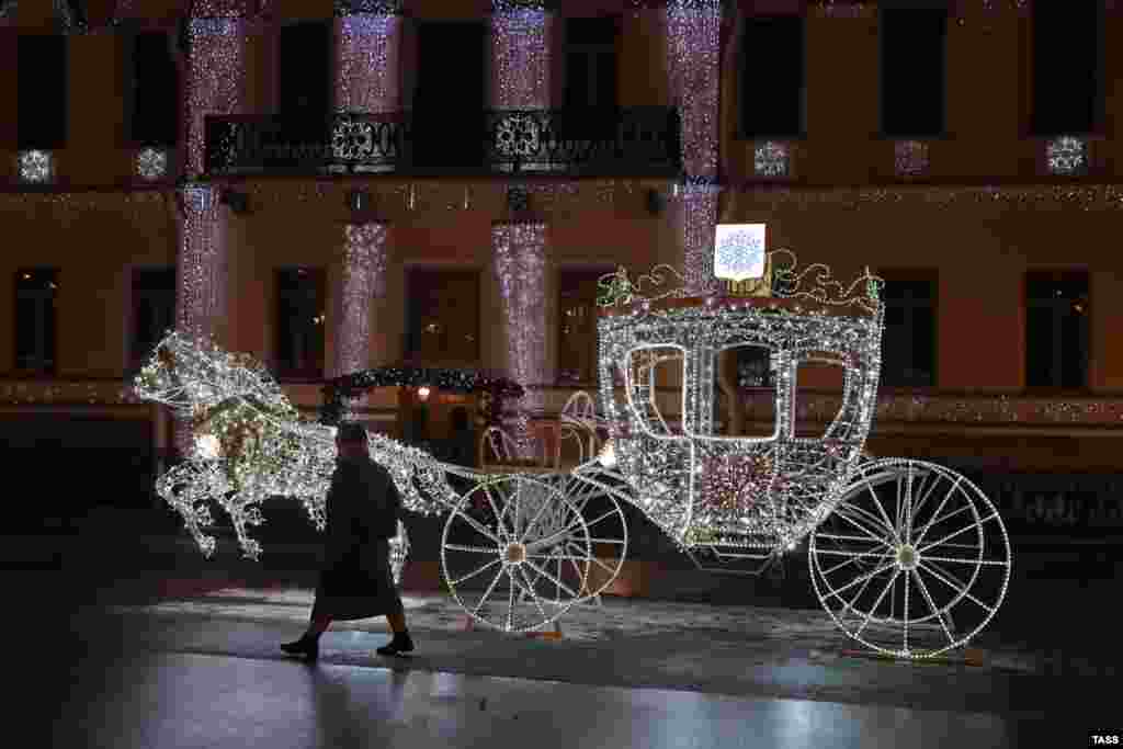 Traditional Christmas light installation in Universitetskaya Embankment., St. Petersburg, December 15, 2020.