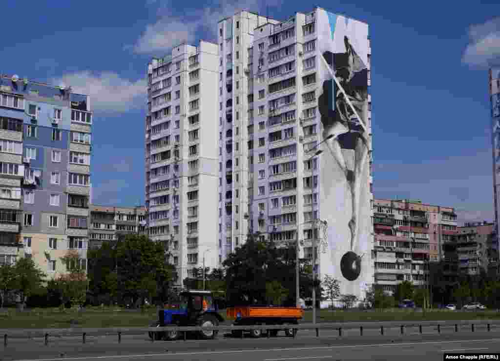 Instability, by Greek artist INO. The 50-meter mural shows a ballerina dancing atop a bomb. 