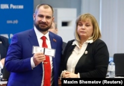 Maksim Suraikin with Ella Pamfilova, head of Russia's Central Election Committee