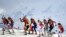 Russia -- Sochi - Athletes compete at the start of the Women's Biathlon 4x6 km Relay at the Laura Cross-Country Ski and Biathlon Center during the Sochi Winter Olympics on February 21, 2014, in Rosa Khutor, near Sochi. AFP PHOTO / ALBERTO PIZZOLI
