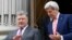Ukrainian President Petro Poroshenko (left) walks with U.S. Secretary of State John Kerry during their meeting in Kyiv on July 7.